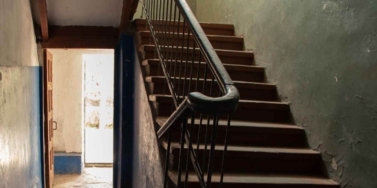 Dark stairwell in parking garage - a common security vulnerability where crimes often occur